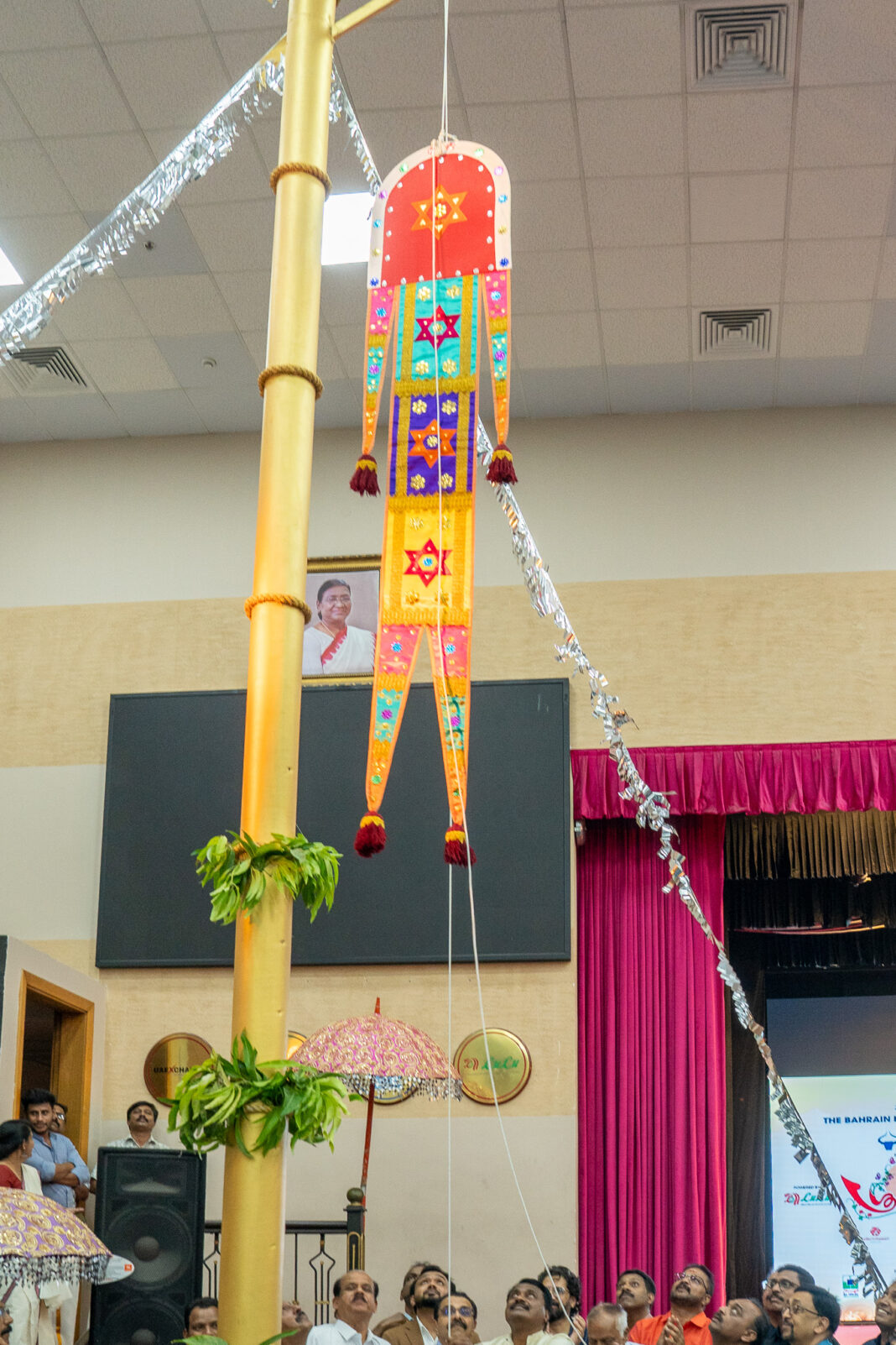 Onam festival flag being raised at BKS Bahrain to officially open the celebration season